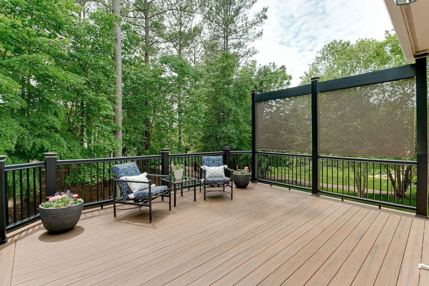 deck patio with blue chairs
