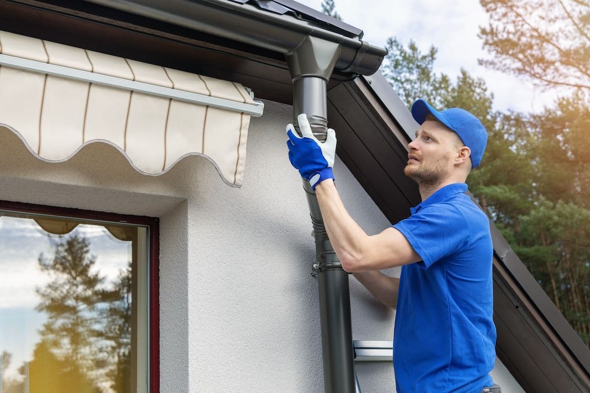 metal-gutter-installation-drain-pipe