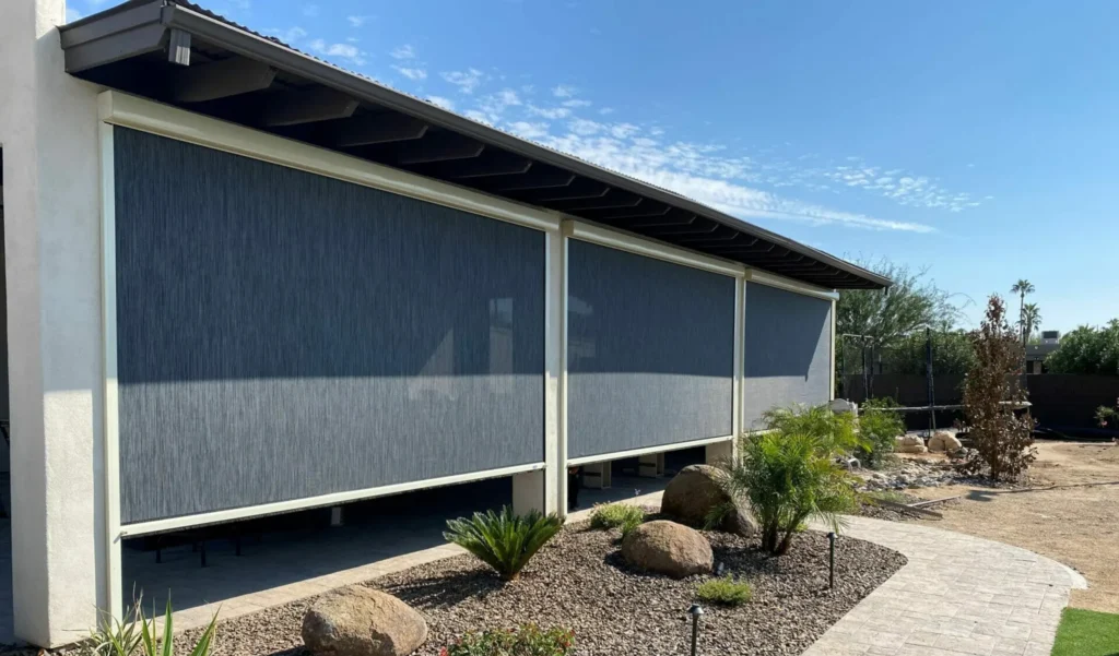 Retractable outdoor screens installed on a covered patio, providing shade, privacy, and year-round usability for outdoor living spaces by Altimate Outdoor.