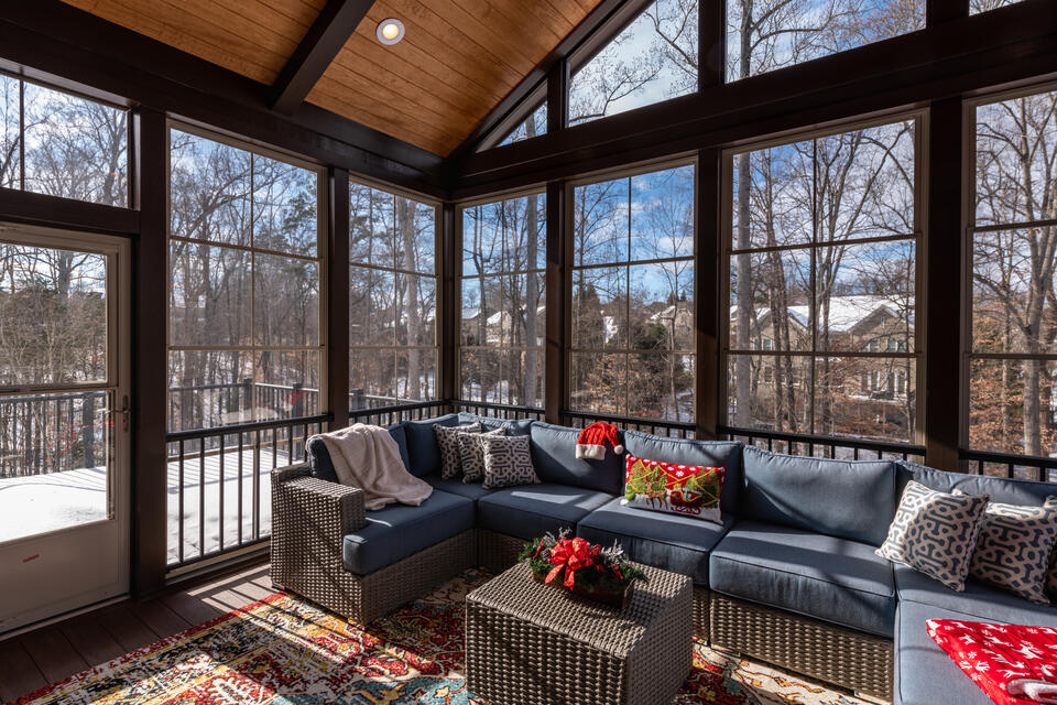 how to winterize a screen porch-large porch screened in and styled with indoor outdoor furniture
