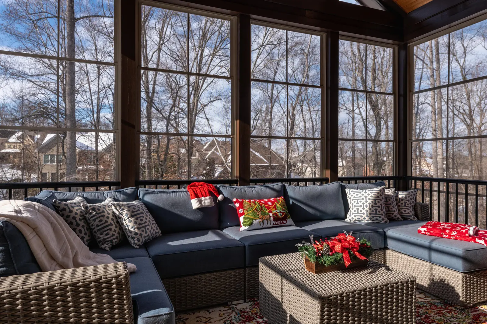 how to winterize a screen porch-large porch styled with indoor outdoor furniture and surrounded by screens